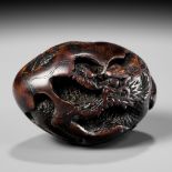 NAITO TOYOMASA: A FINE WOOD NETSUKE OF A DRAGON EMERGING FROM AN EGG