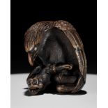 NOBUKAZU: A FINE WOOD NETSUKE OF AN EAGLE ATTACKING A MONKEY