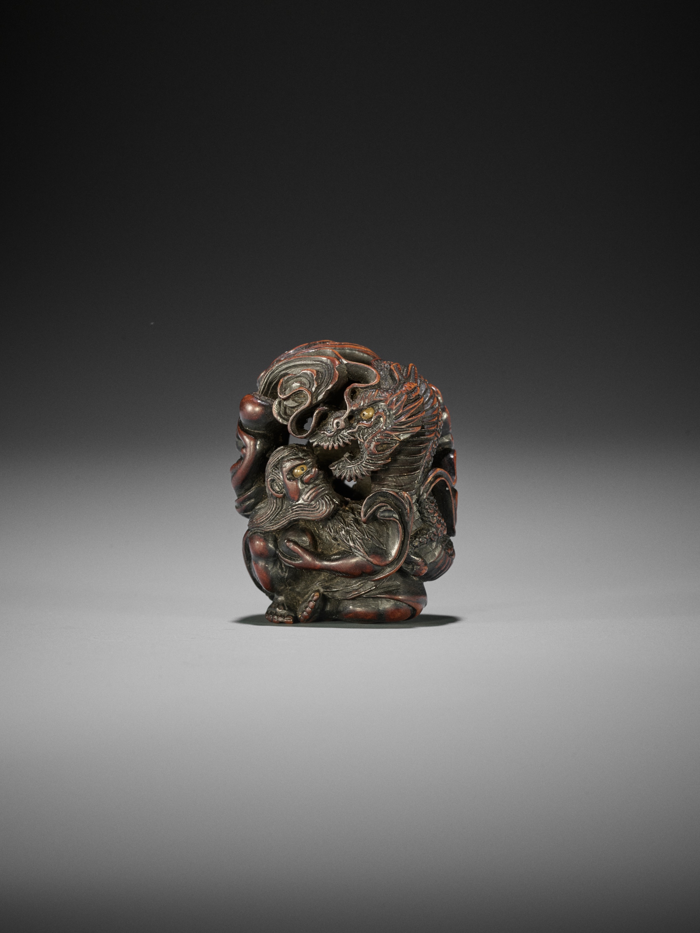 SADAKATA: A SUPERB WOOD NETSUKE OF RAKAN HANDAKA SONJA WITH DRAGON - Image 4 of 15