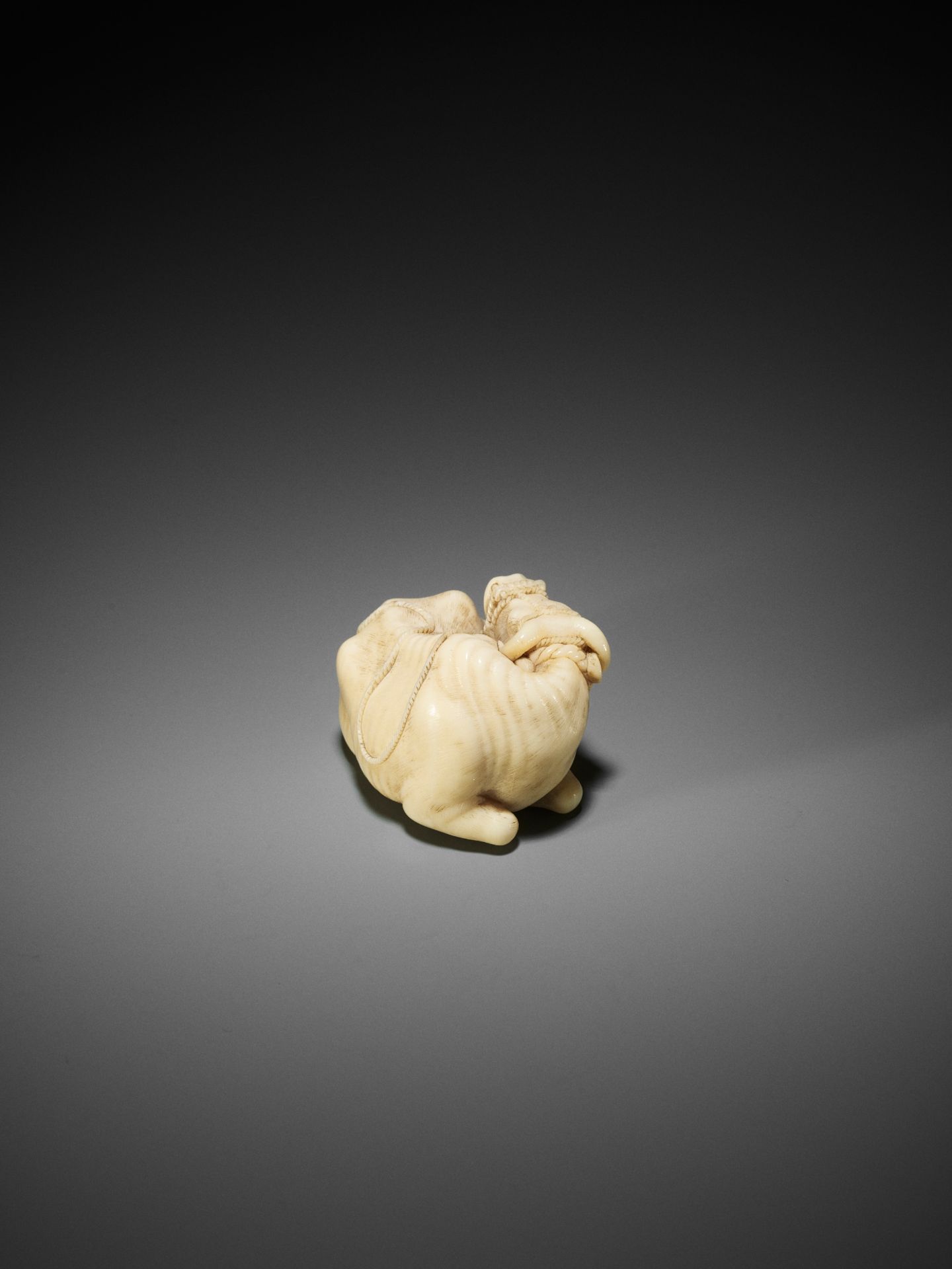 KAIGYOKUSAI MASATSUGU: A MASTERFUL AND IMPORTANT IVORY NETSUKE OF A RECUMBENT OX - Image 26 of 30