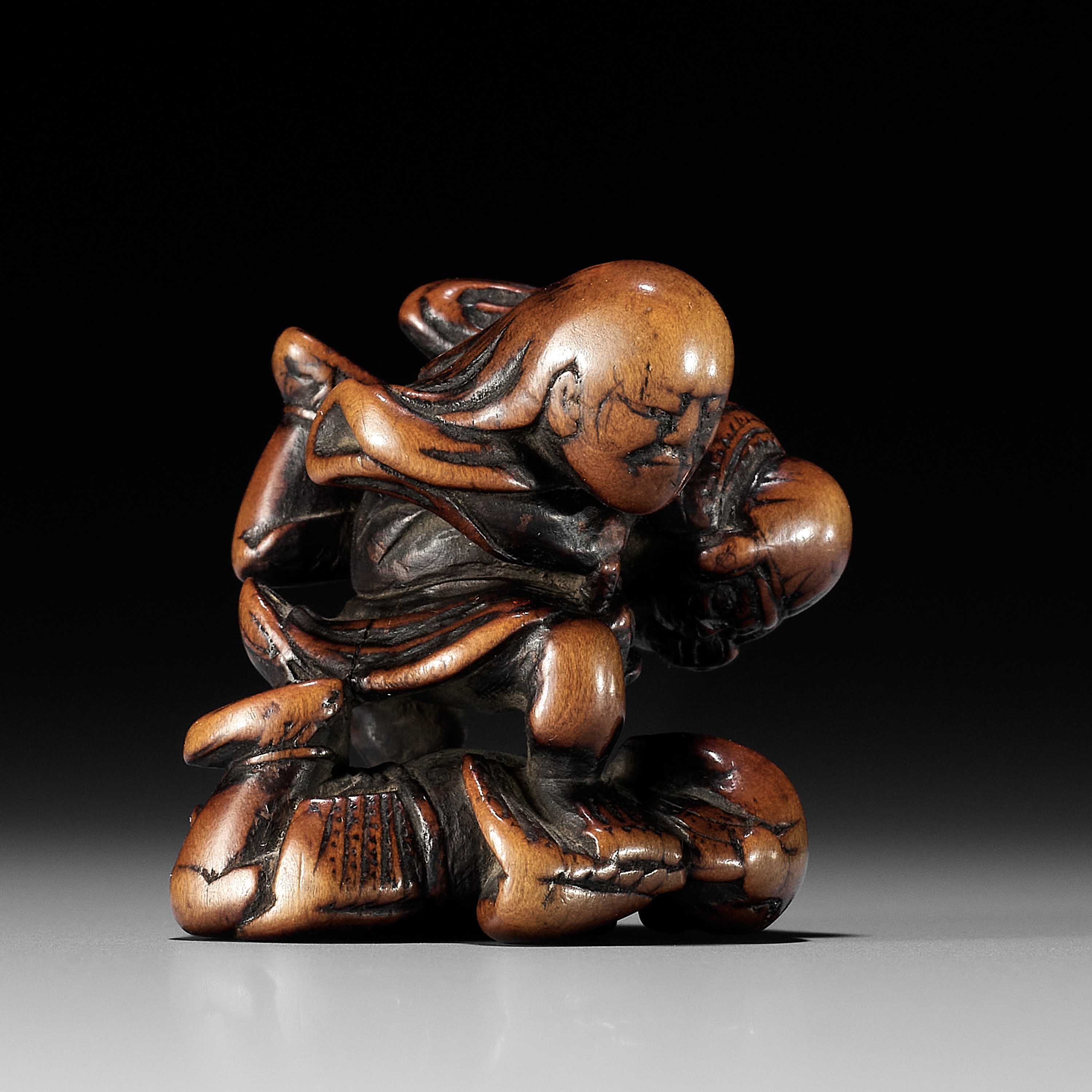 NAGAMITSU: A RARE WOOD NETSUKE OF GOBAN TADANOBU