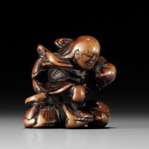 NAGAMITSU: A RARE WOOD NETSUKE OF GOBAN TADANOBU