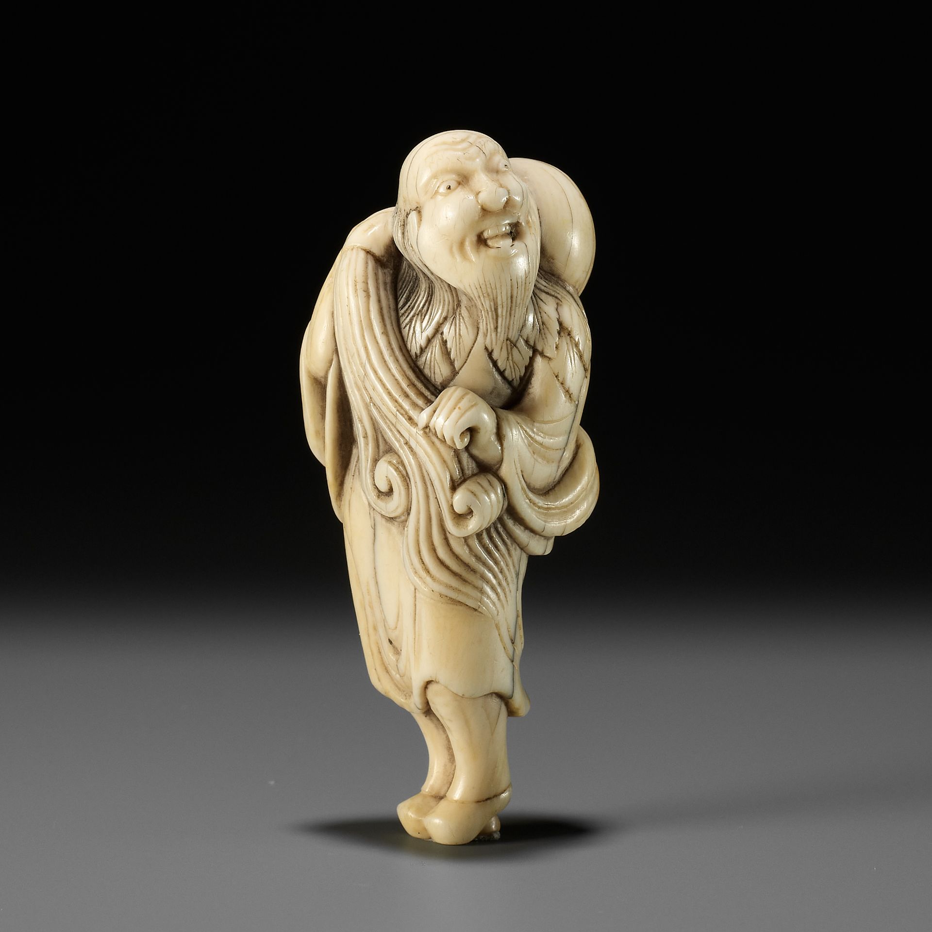 AN IVORY NETSUKE OF CHOKARO SENNIN