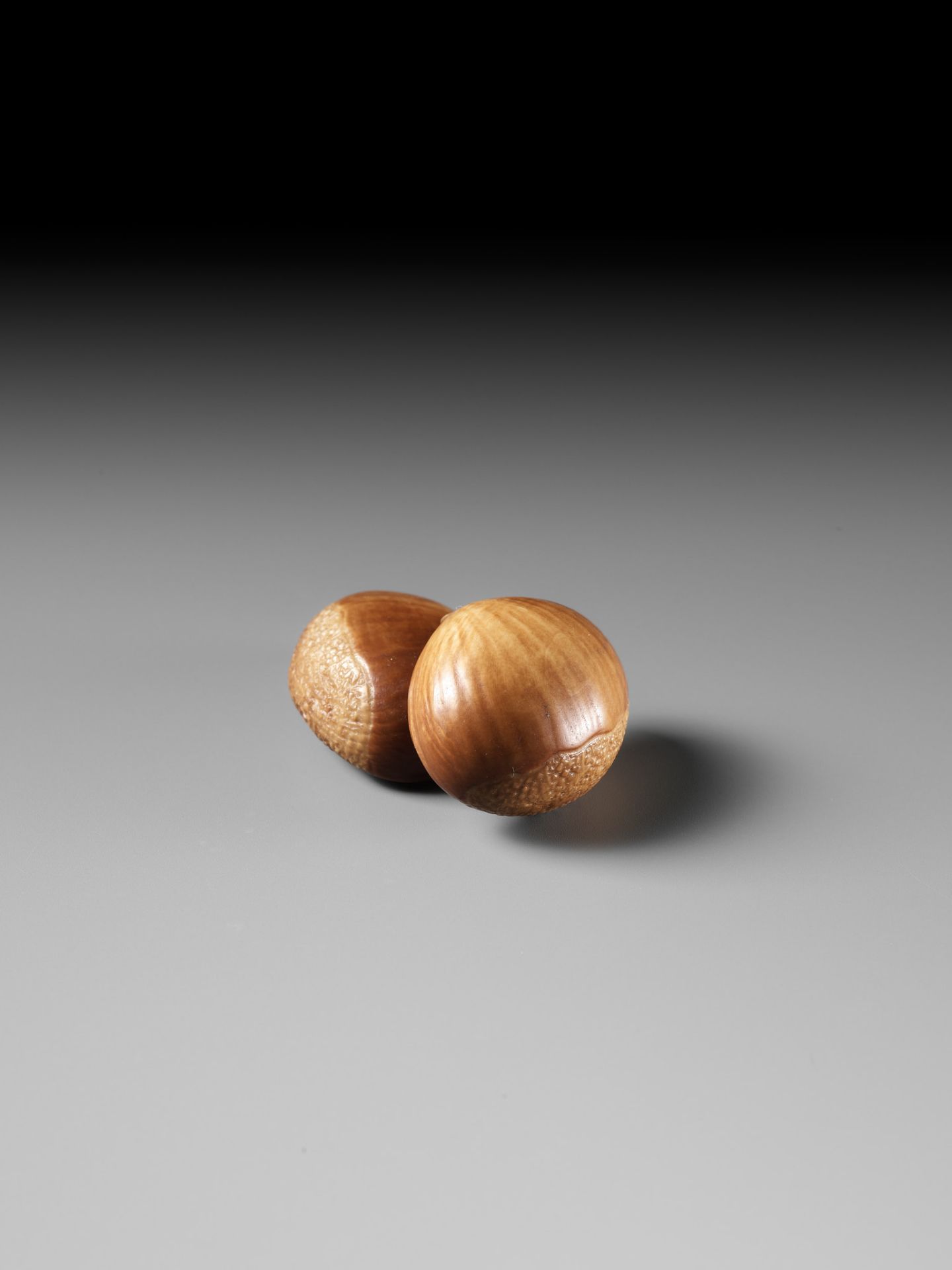 ANDO RYOKUZAN: A FINE LACQUERED IVORY NETSUKE OF TWO CHESTNUTS - Image 6 of 11