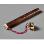 A FINE BAMBOO AND ANTLER YATATE, WITH AN ANTLER NETSUKE OF A MONKEY HOLDING A PEACH