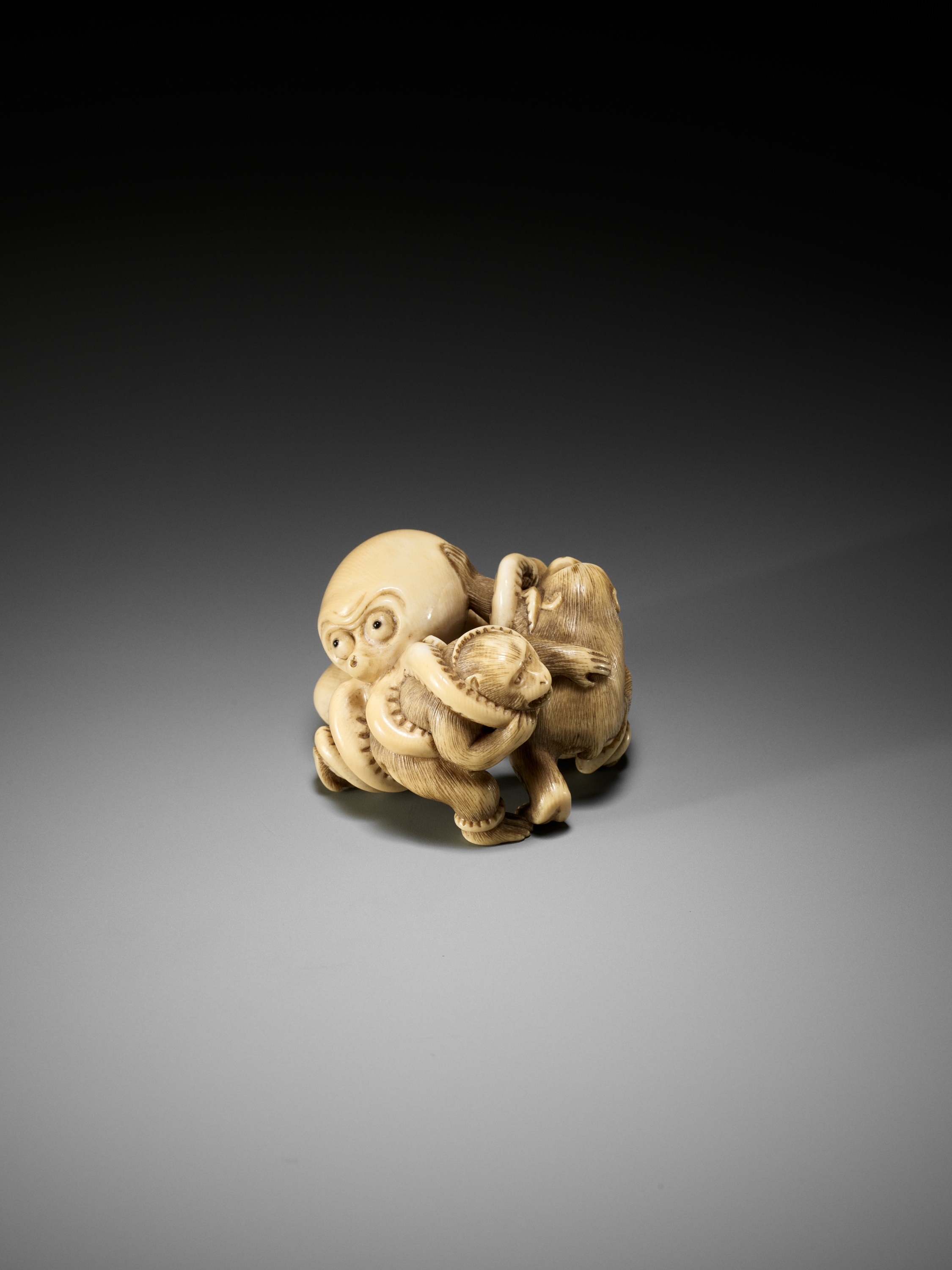 IKKOSAI: A SUPERB IVORY NETSUKE OF TWO MONKEYS FIGHTING AN OCTOPUS - Image 4 of 15