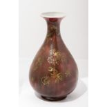 A CHINESE RED PORCELAIN VASE WITH GOLDEN FLOWERS FOR IMPERIAL USE
