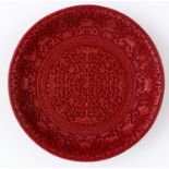 A CHINESE WOOD-CARVED CINNABAR LACQUER DISH