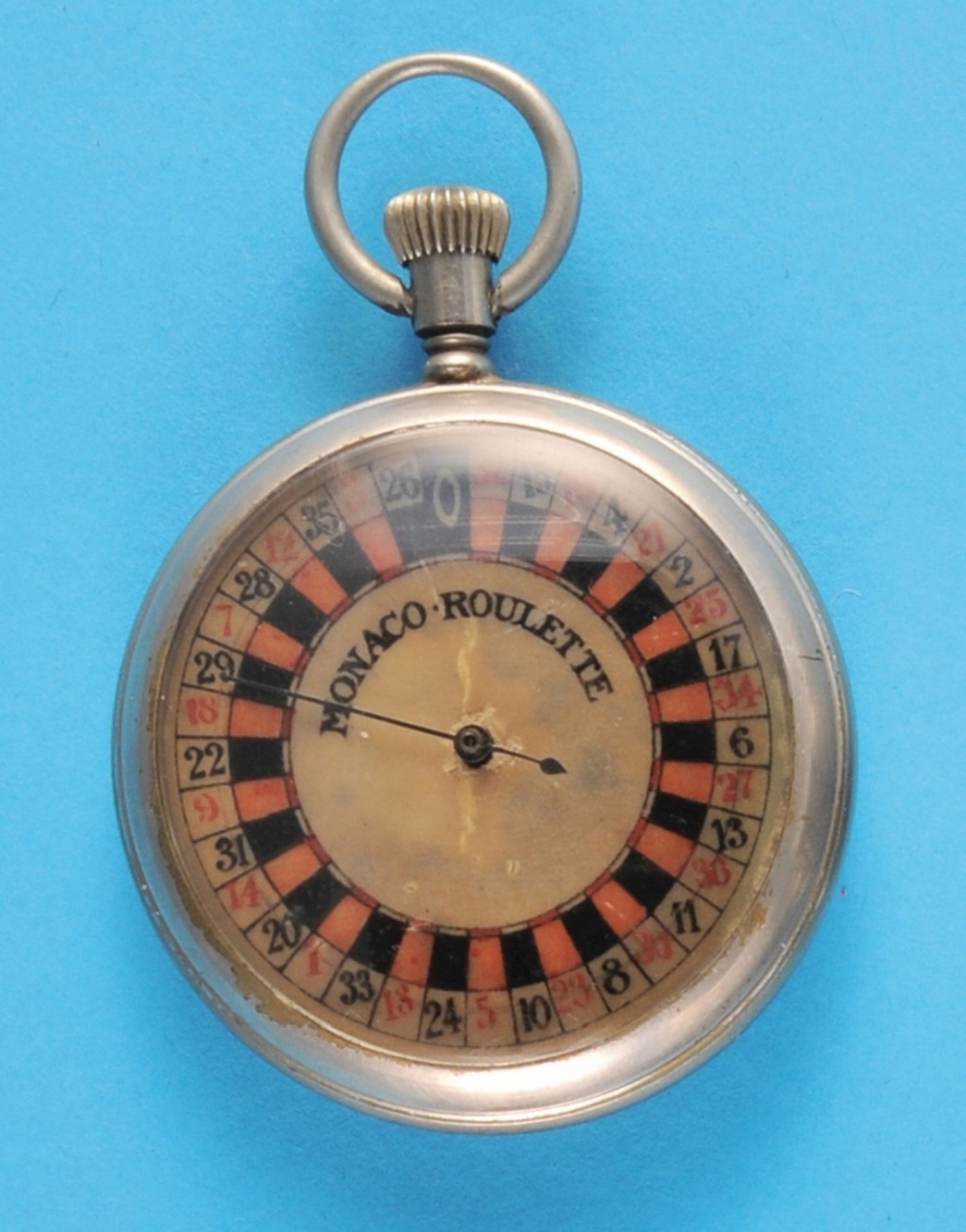 Monaco-Roulette Dèposé, in a nickel pocket watch case, dial with red/black roulette numbers
