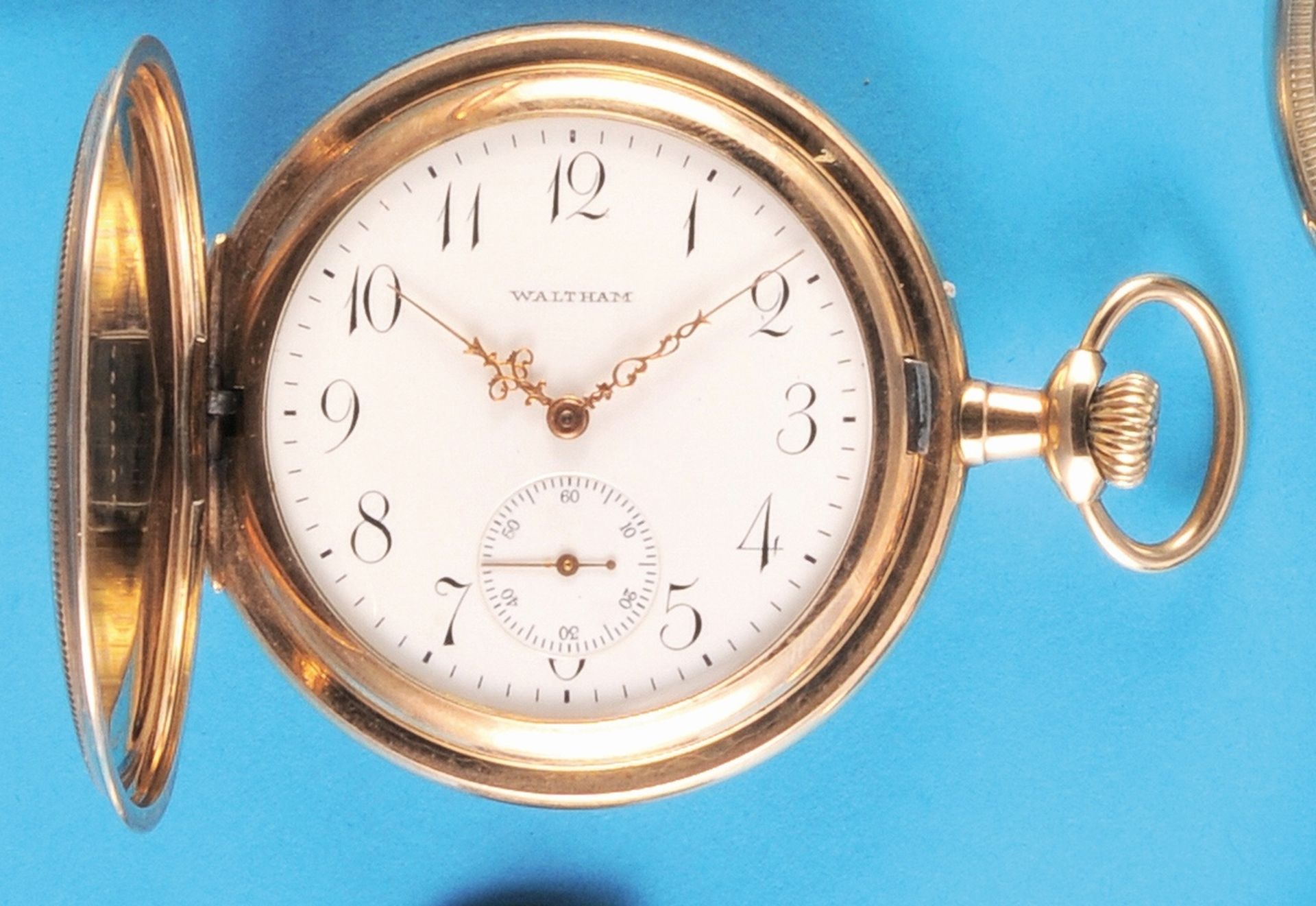 Waltham, gilt pocket watch with sprung cover, engine-turned case case with small monogram E.W.,