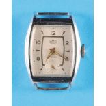 UMF Ruhla, tonneau-shaped chrome-plated case, silvered dial with gilt hour markers and Arabic numera