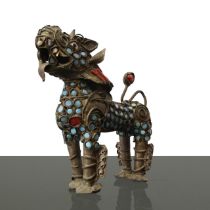 Brass Buddhist lion decorated with coral and turquoise, 1900