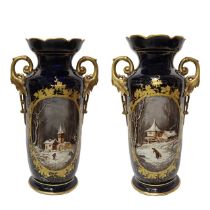 Pair of dark blue porcelain vases in the Sevres style, with handles and landscapes on the front, Lat