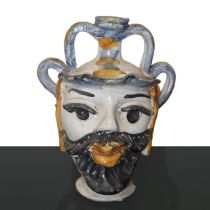 Head in polychrome majolica from Caltagirone., Early 20th century