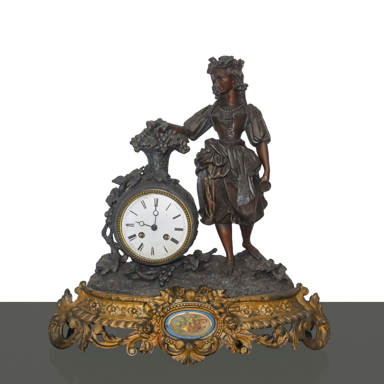 Pendulum table clock with golden metal base and applied porcelain, Late 19th century