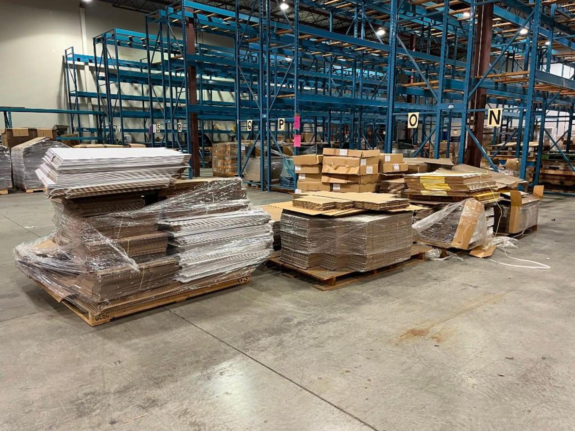 Lot of (7) Pallets Asst. Cardboard Boxes and Plastic Bags.