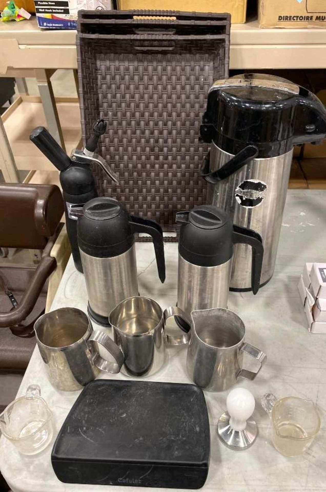 LOT OF ASSORTED CAFE EQUIPMENT INCLUDING: TAMPER, FROTHING PITCHERS, WHIPPED CREAM DISPENSER, AIRPOT