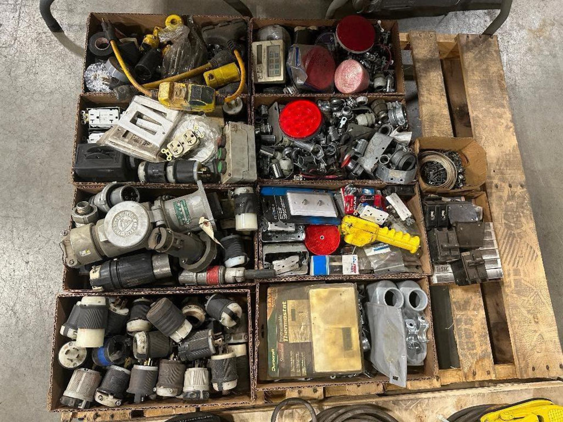 Pallet of Asst. electrical Components including Outlets, Cord Ends, Lights, Breakers, etc.