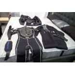 Lot of (2) Wet Suits, Duffle Bag and Weight Belt.