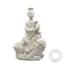 A CHINESE BLANC DE CHINE FIGURE OF A LADY AND LION DOG GROUP, QING DYNASTY, LATE 19TH CENTURY