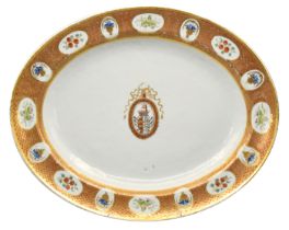 A CHINESE EXPORT PORCELAIN ‘PORTUGUESE-MARKET’ ARMORIAL MEAT DISH, JIAQING PERIOD, CIRCA 1810