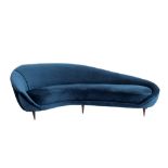Federico Munari Curved sofa with padding upholstered in teal velvet, wooden legs