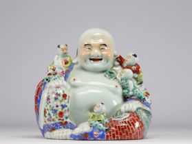 China - Porcelain Buddha surrounded by other small Buddhas, early 20th century.