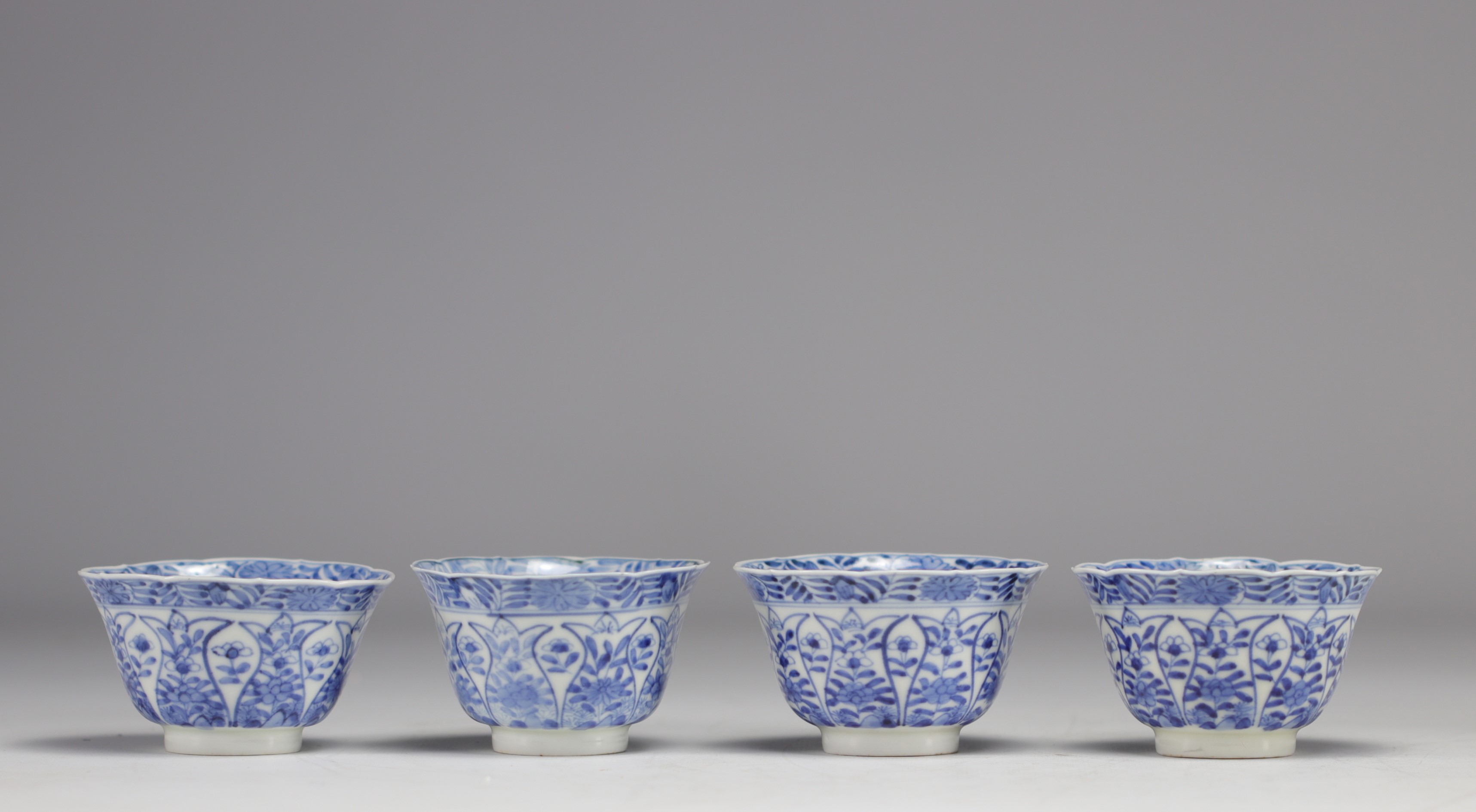 Set of white and blue bowls and saucers with various flower decorations from 18th century - Image 2 of 6