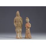China - Two polychrome terracotta statues in the form of figures, from the Tang period (618-907).