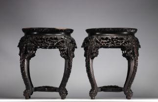 Pair of "Floral" carved wooden tables with marble tops, Chinese work, 19th century.