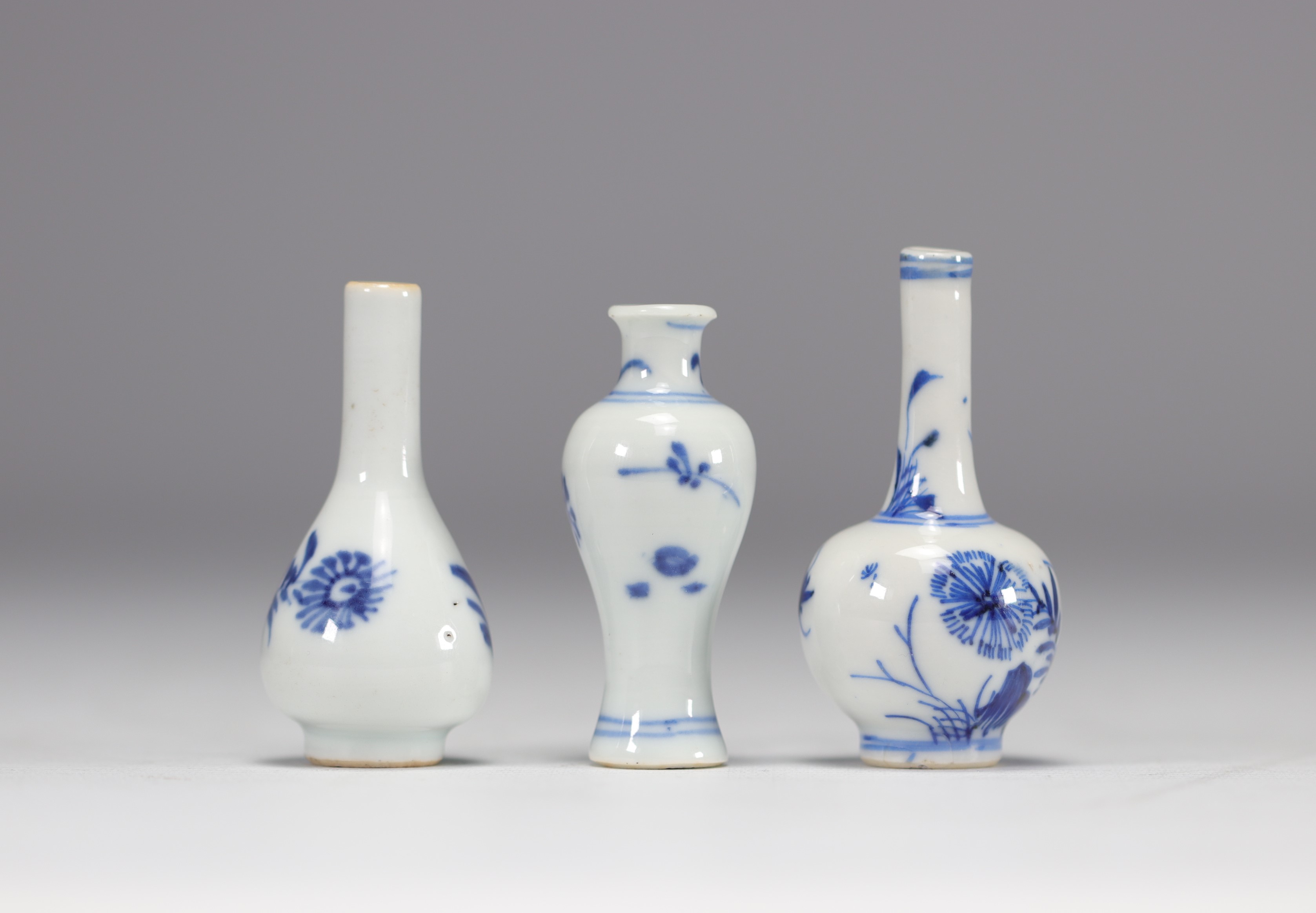 (3) Set of three miniature vases of different shapes in white and blue from the Kangxi period (1661-