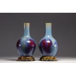 Rare pair of porcelain vases with flamed glaze mounted on bronze from 18th century