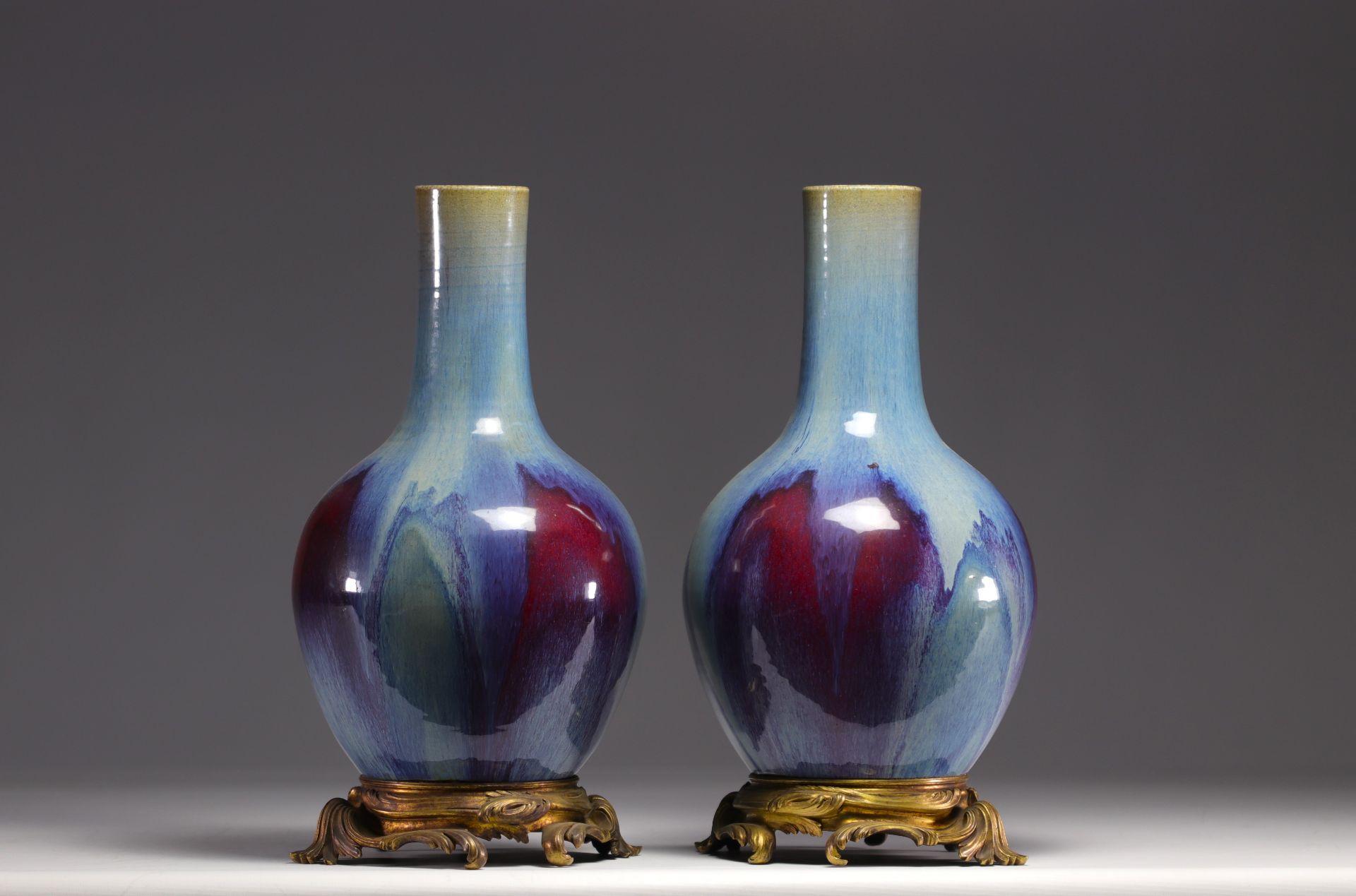 Rare pair of porcelain vases with flamed glaze mounted on bronze from 18th century