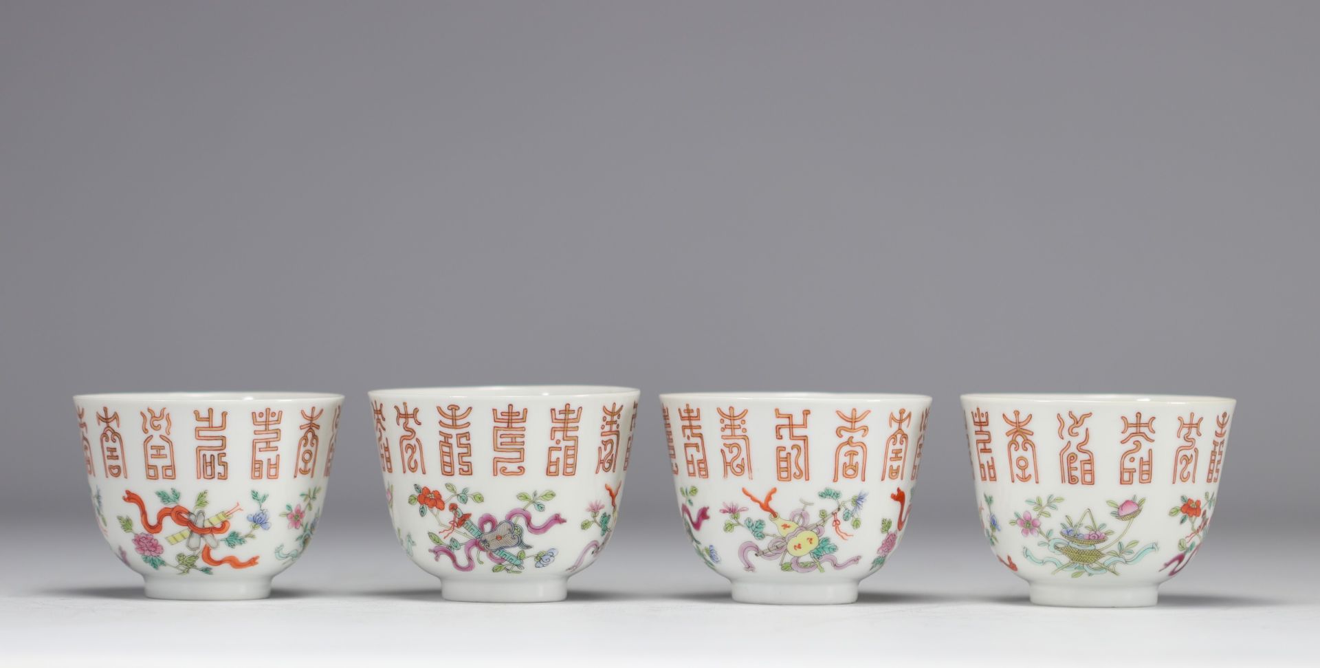 Set of four bowls decorated with flowers and calligraphy of the Gangxu period (1875-1908) and with m