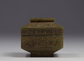 China - covered box in carved jade with archaic decoration.