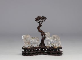 China - Rock crystal Fo dogs on finely carved wooden base, 19th century