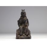 Bronze statue of a traditional figure with dark patinas and traces of gilding from Ming period China