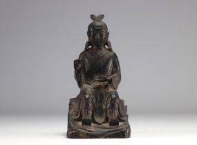 Bronze statue of a traditional figure with dark patinas and traces of gilding from Ming period China