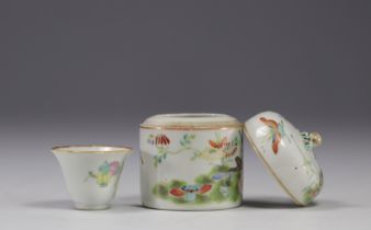 China - Small covered pot enclosing a cup in famille rose porcelain decorated with butterflies.