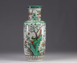 China - A green family porcelain vase decorated with trees and birds, early 20th century.