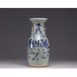 China - A blue-white porcelain vase on a celadon background decorated with figures, 19th century.