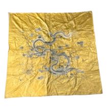 China - Gold silk tapestry decorated with blue dragons.