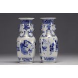 China - Pair of blue-white porcelain vases with figures, Kangxi mark, 19th century.