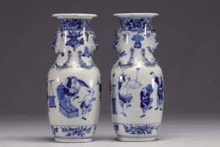 China - Pair of blue-white porcelain vases with figures, Kangxi mark, 19th century.