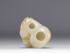 White and rust jade brushes carved in the shape of a fruit, Qianlong period, 18th century