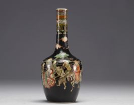 China - Black family porcelain vase decorated with figures and horsemen, Kangxi mark.