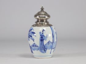 A white and blue vase decorated with women surmounted by a silver stopper with a mark under the piec