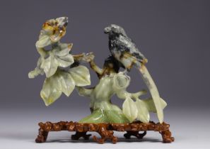 China - "Parrot and flowers" sculpture on wooden base, early 20th century.