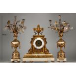 Imposing Louis XVI ormolu and white marble clock and candelabra.