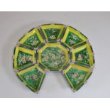 Set of nine porcelain trays with flowers on a green background, Qing period